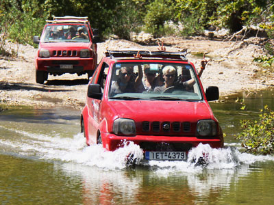 jeeps through the water